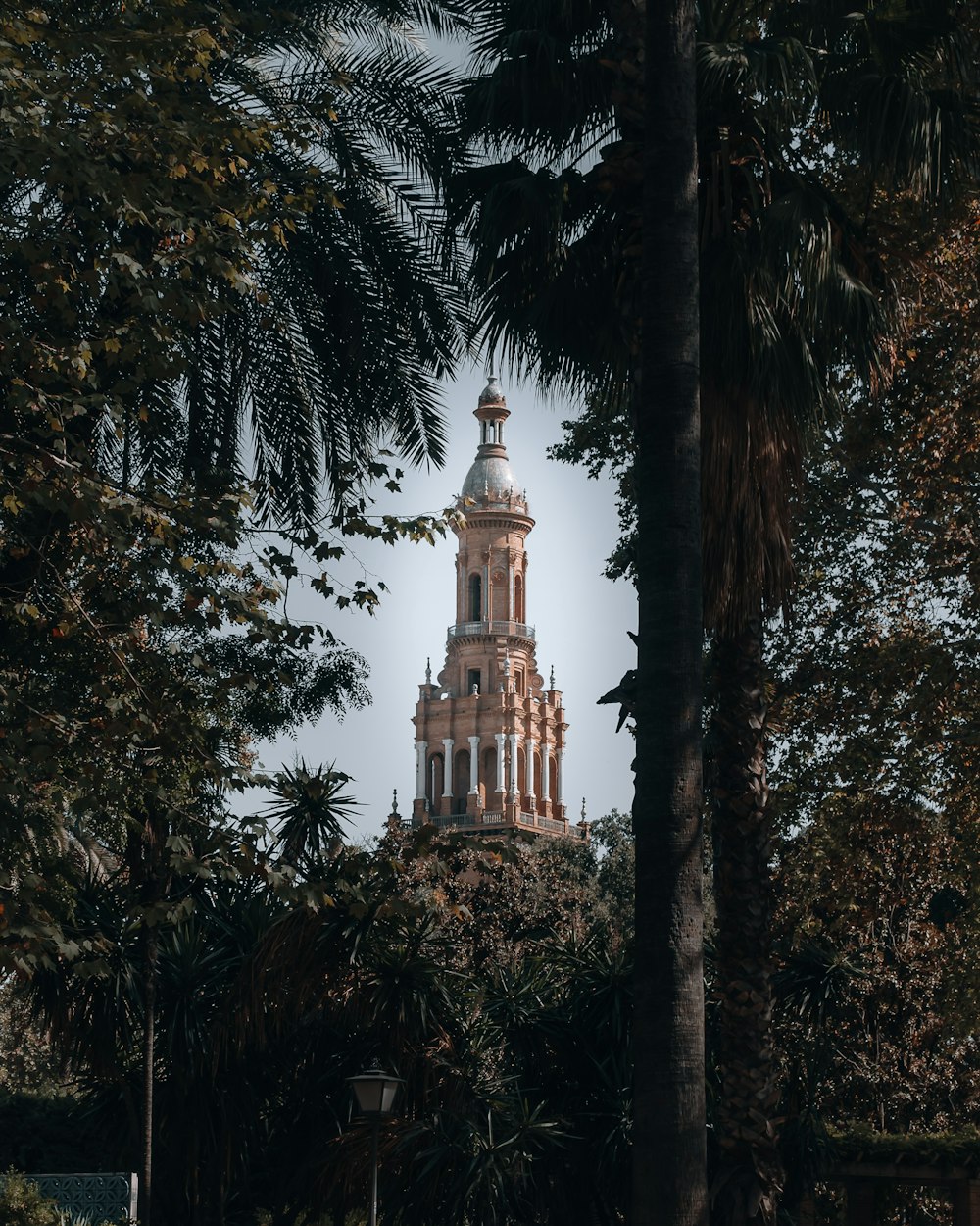 brown concrete building surrounded by trees during daytime