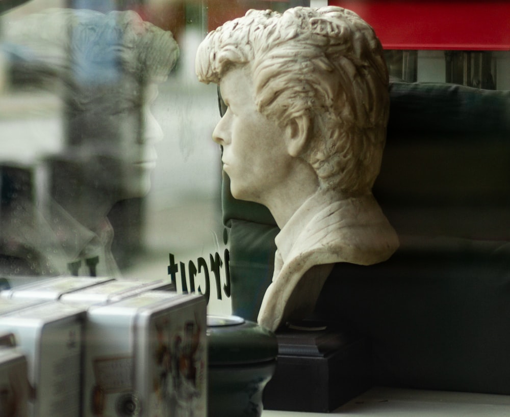 white ceramic statue of man