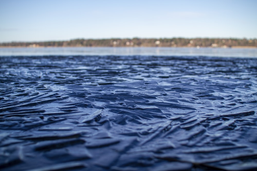 body of water under blue sky during daytime