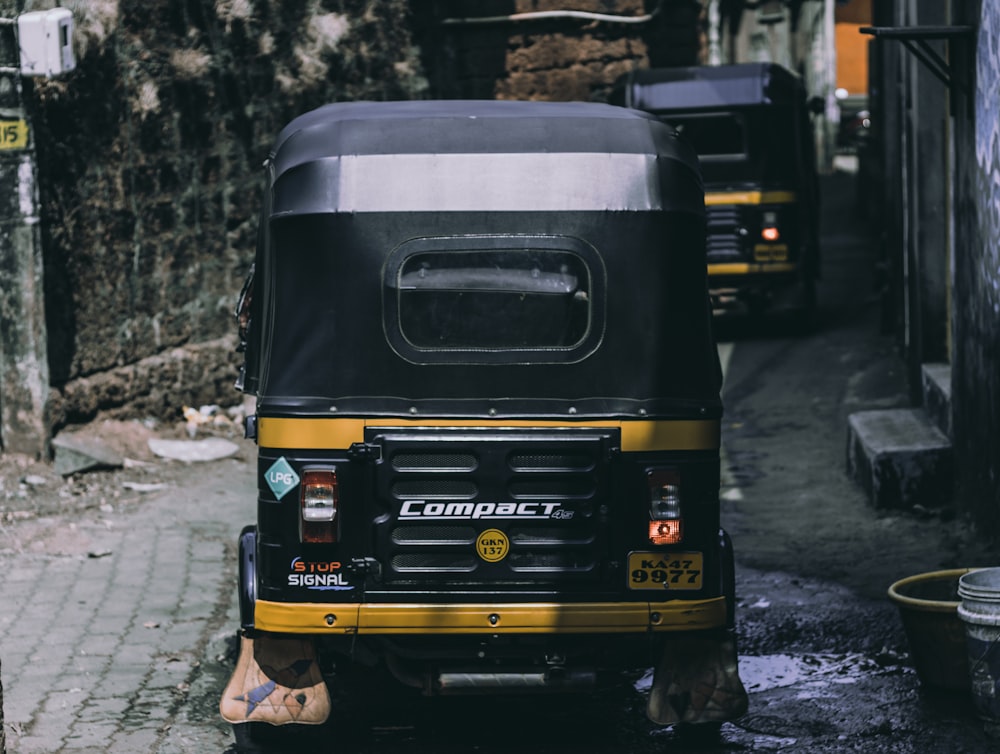 black and yellow car on road during daytime