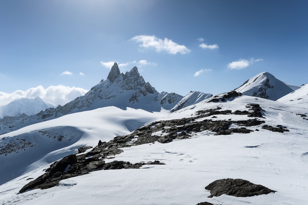 snow covered mountain under blue sky during daytime