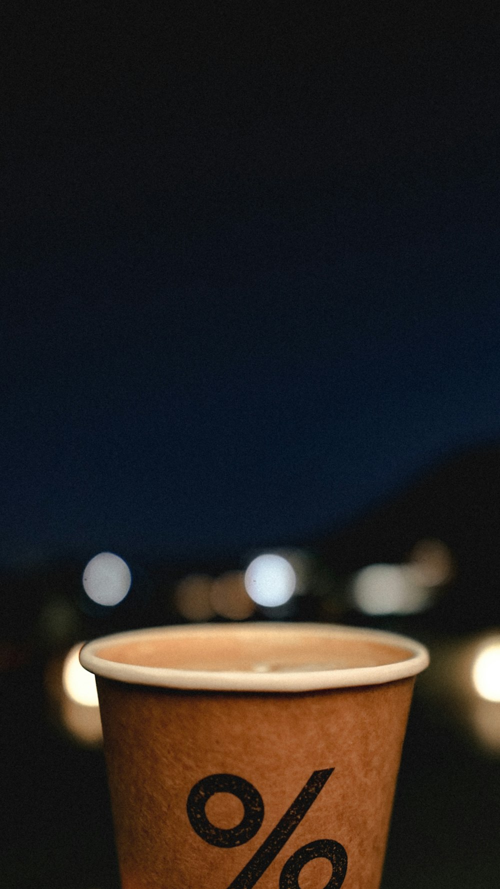 brown ceramic mug with brown liquid