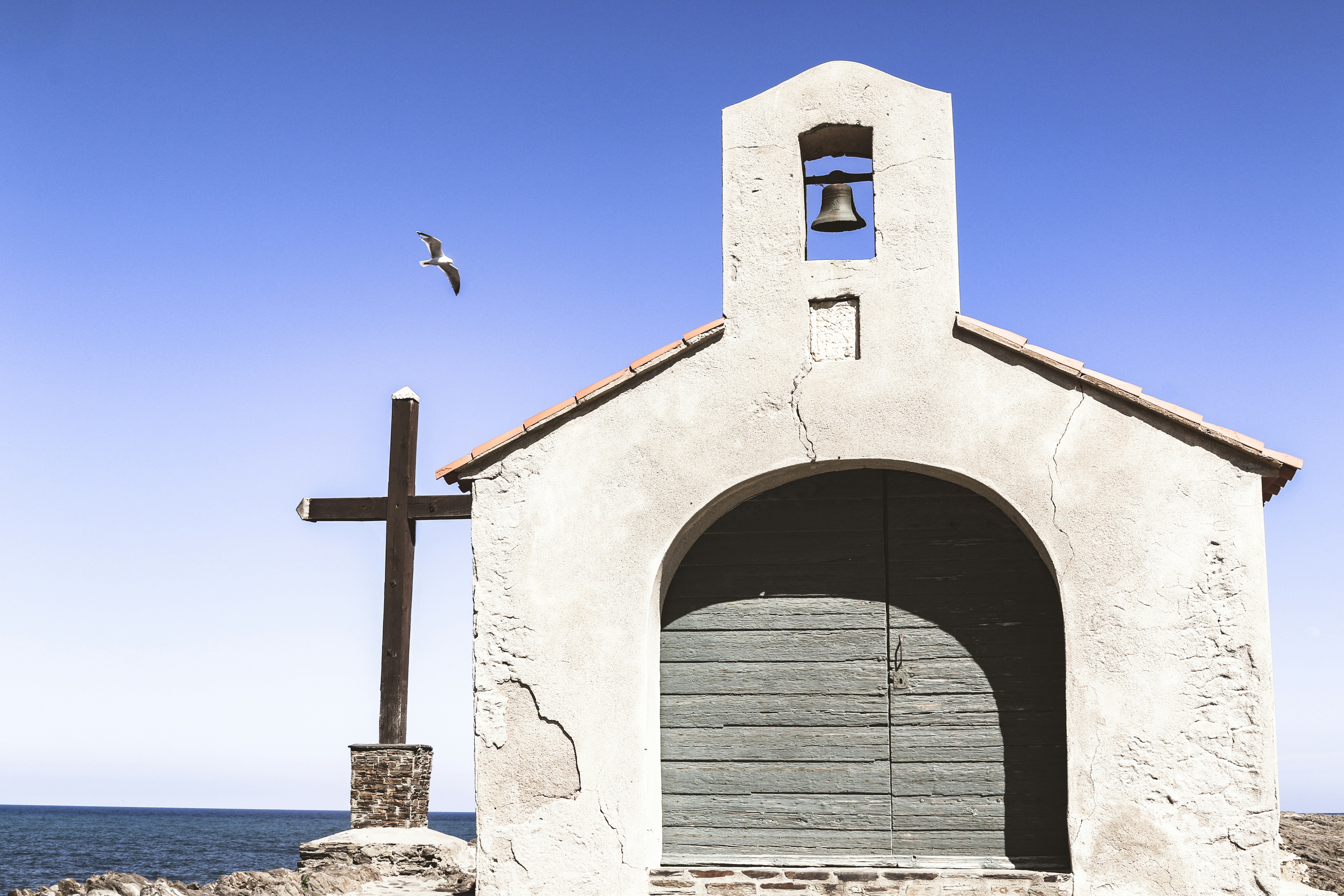 white concrete building with black metal window frame