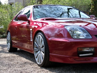 A vibrant red coupe gleaming on the lot, ready for its next adventure.