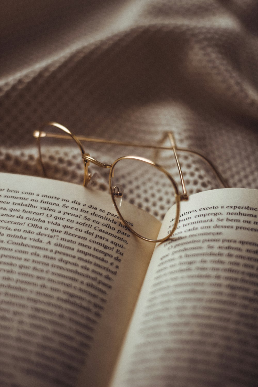 gold framed eyeglasses on book page