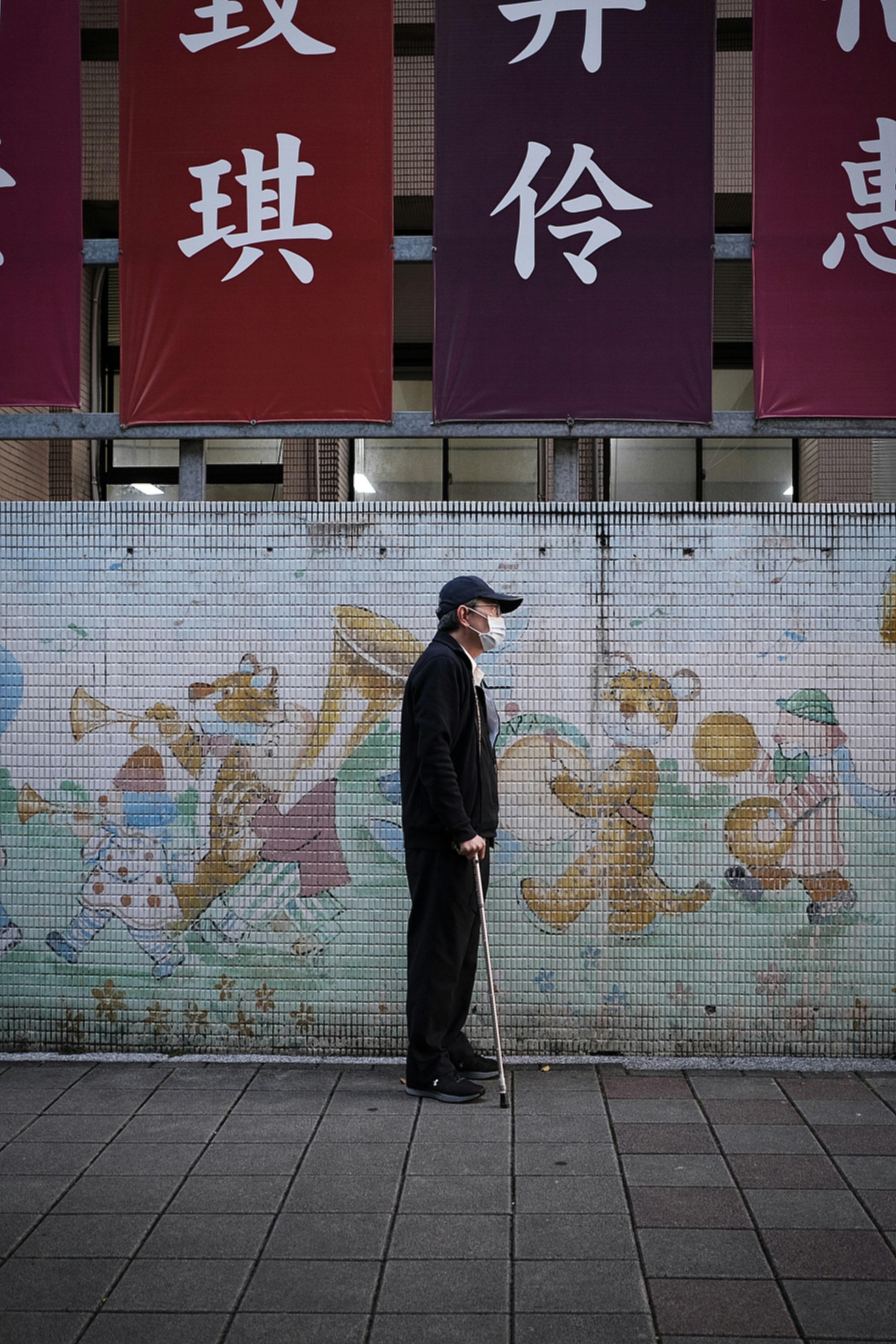 Man in black coat standing in front of wall with graffiti - Free Photo ...