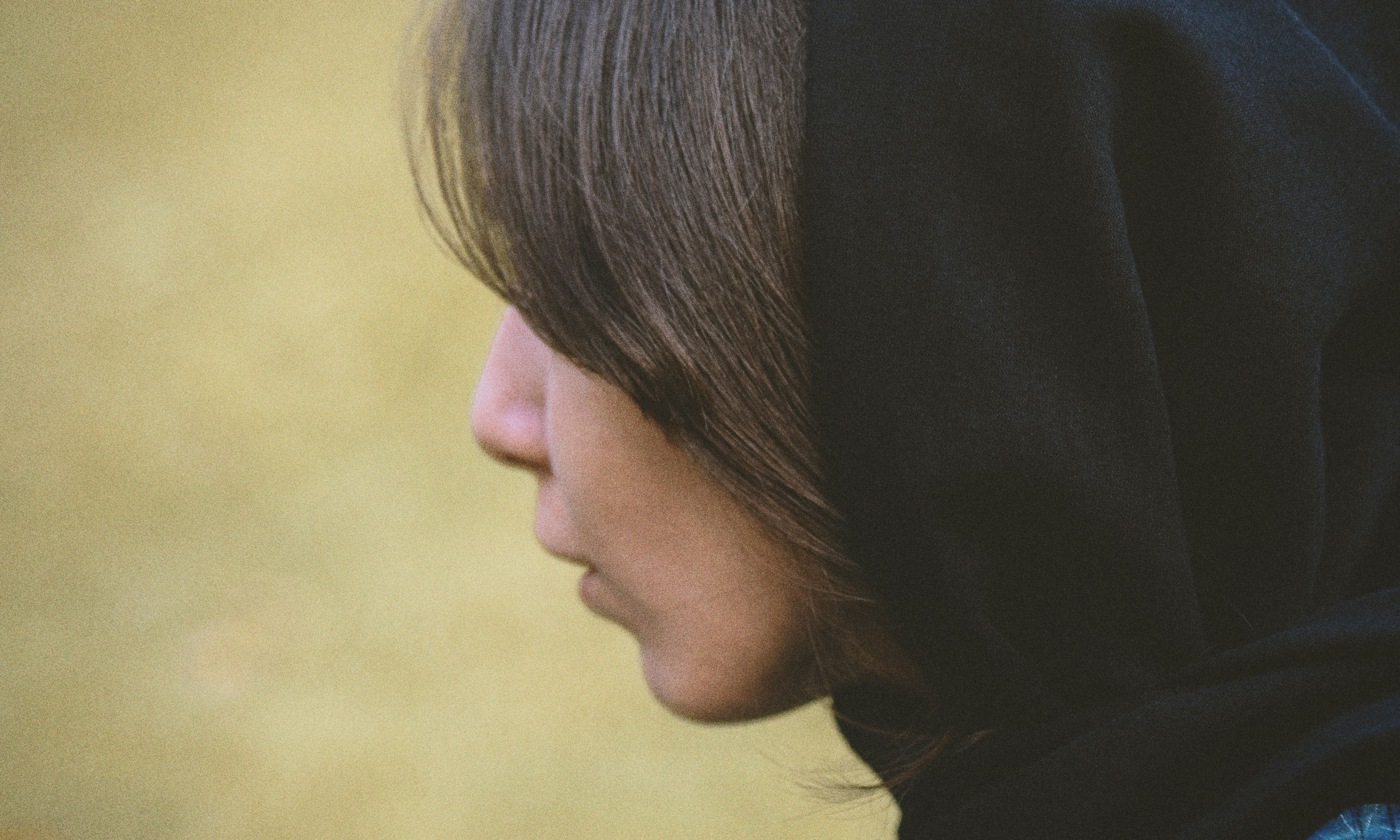 woman in black hijab looking down