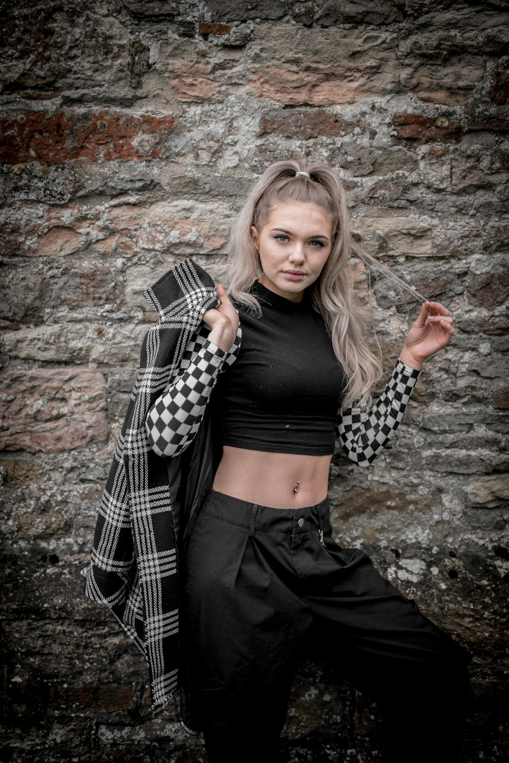 woman in black and white checkered long sleeve shirt