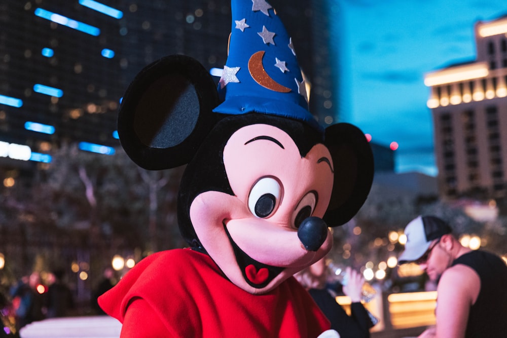 mickey mouse mascot in red jacket