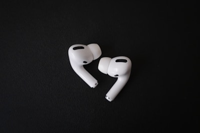 A pair of modern wireless earbuds with noise cancellation features.