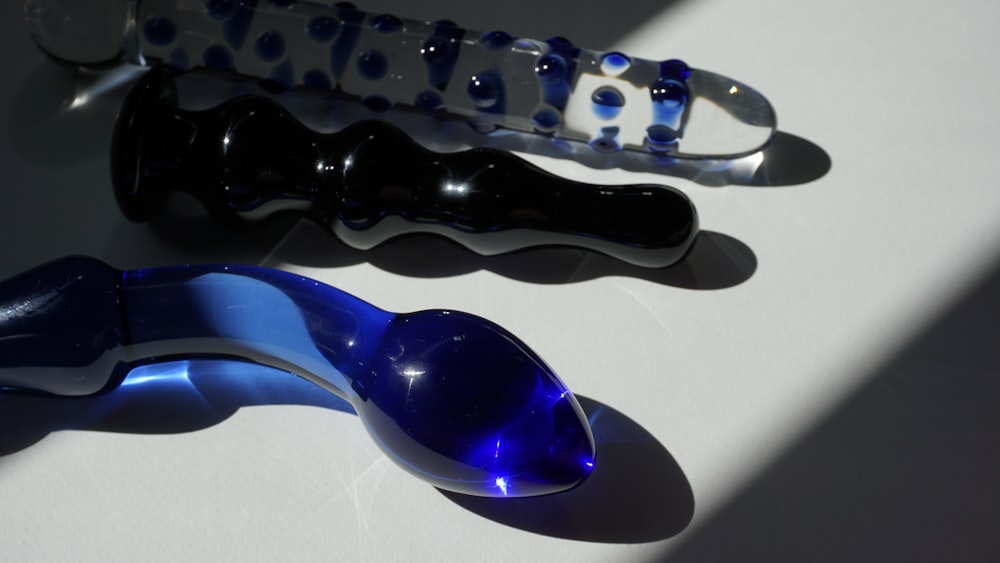 purple and black glass spoon pipe