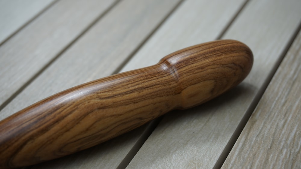 brown wooden handle on white wooden table