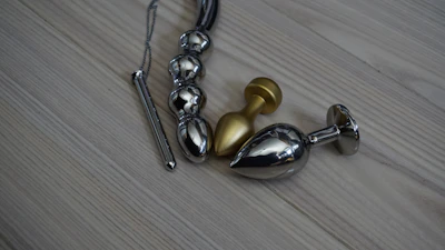Close-up of polished metal and wood furniture pieces ready for auction