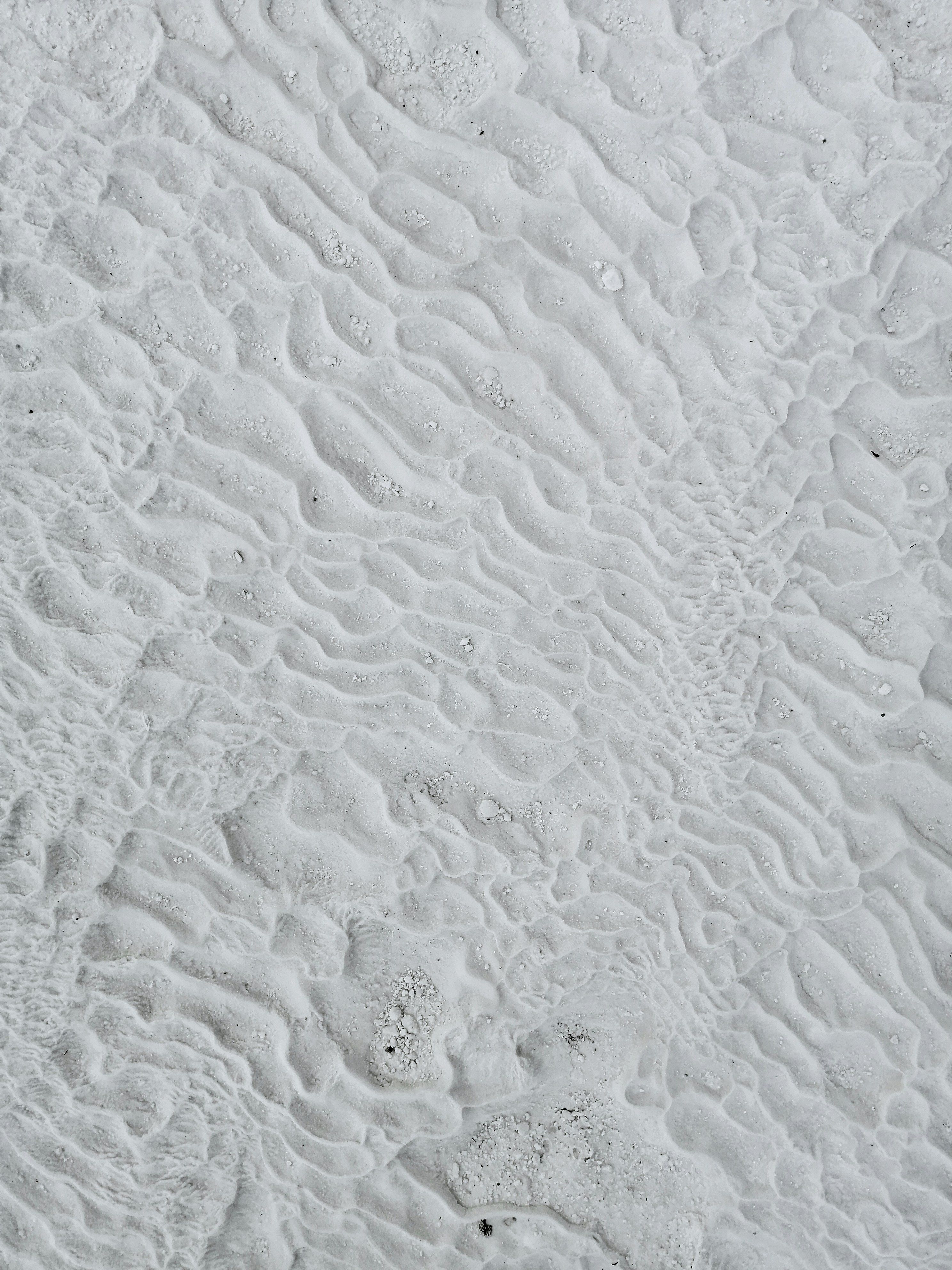 white sand with water droplets