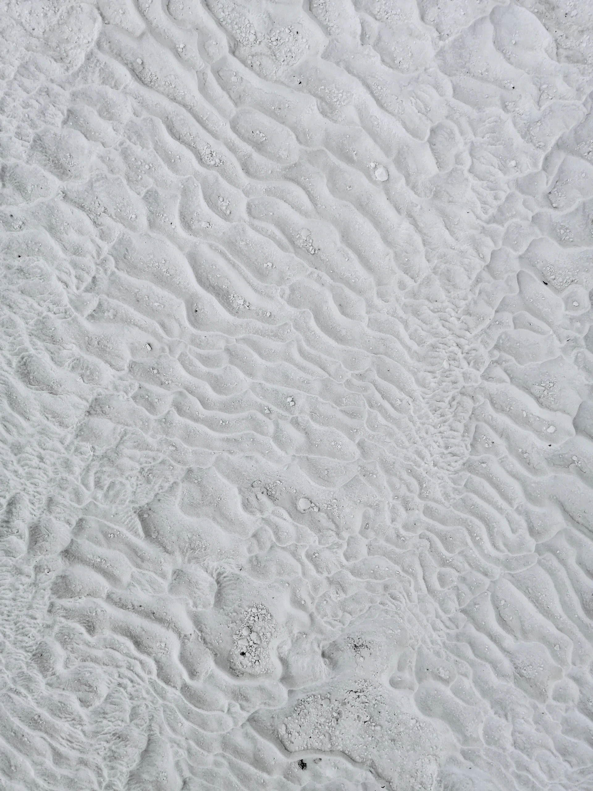 white sand with water droplets