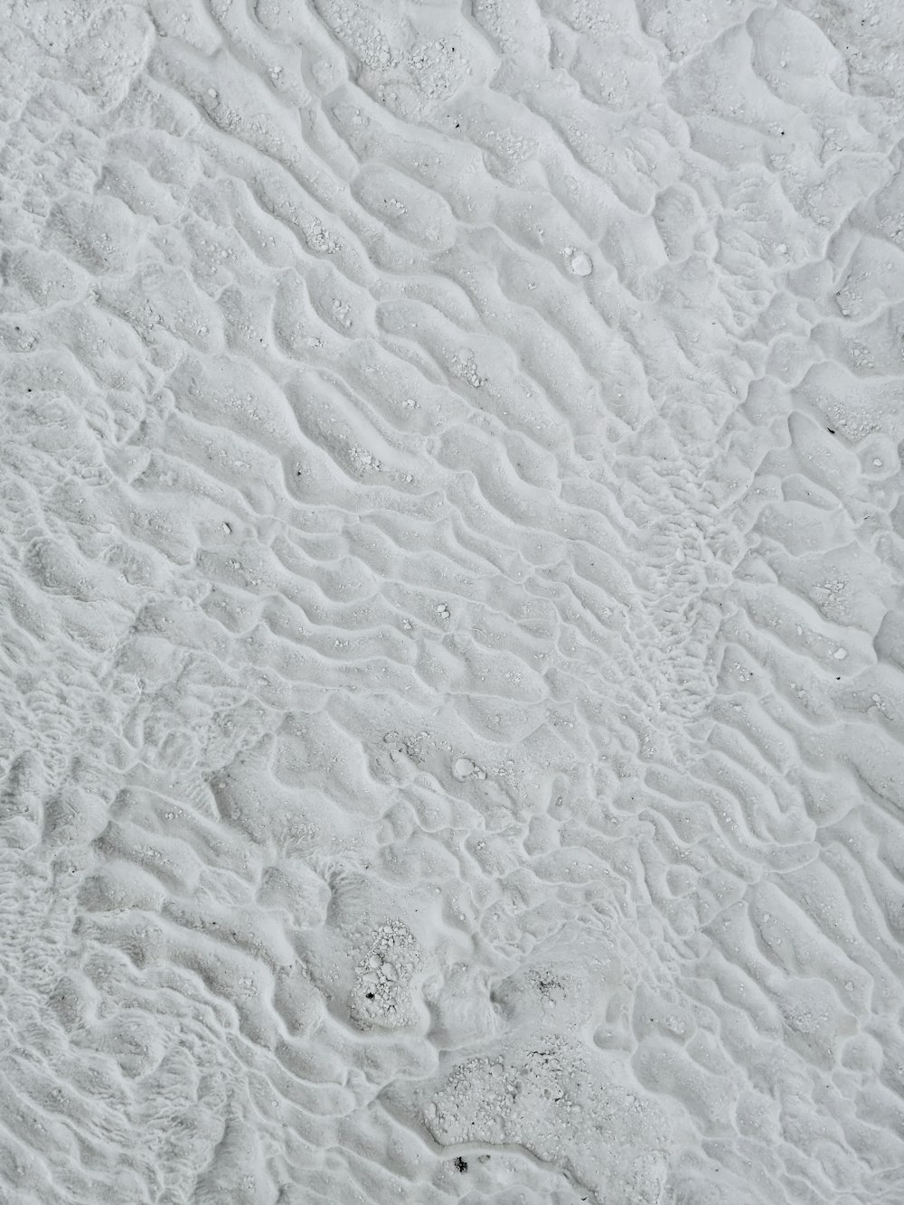 white sand with water droplets