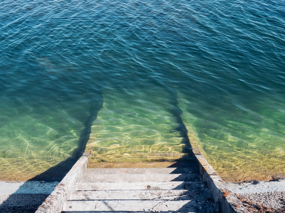 brown wooden dock on body of water during daytime