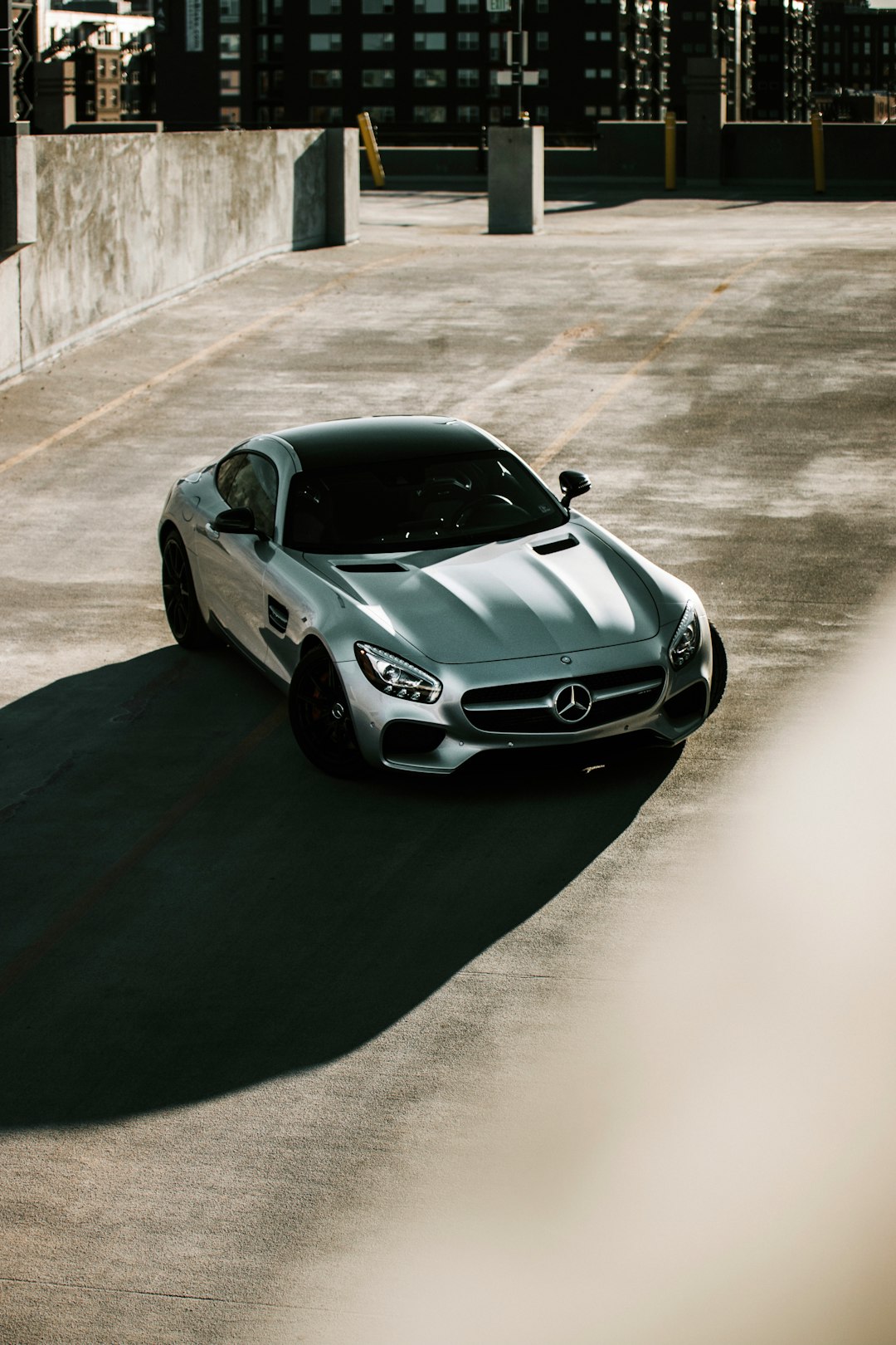 silver mercedes benz coupe on road