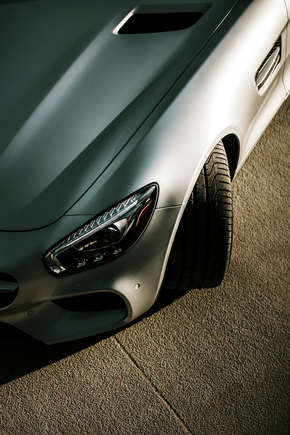 white car on gray concrete floor