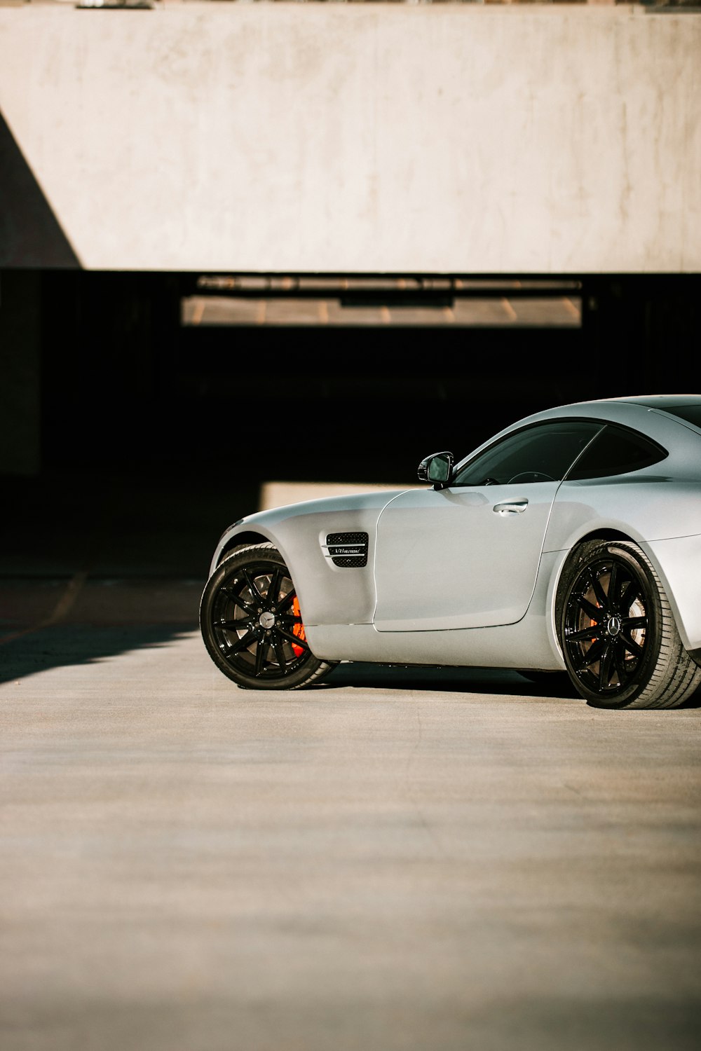 silver porsche 911 on road