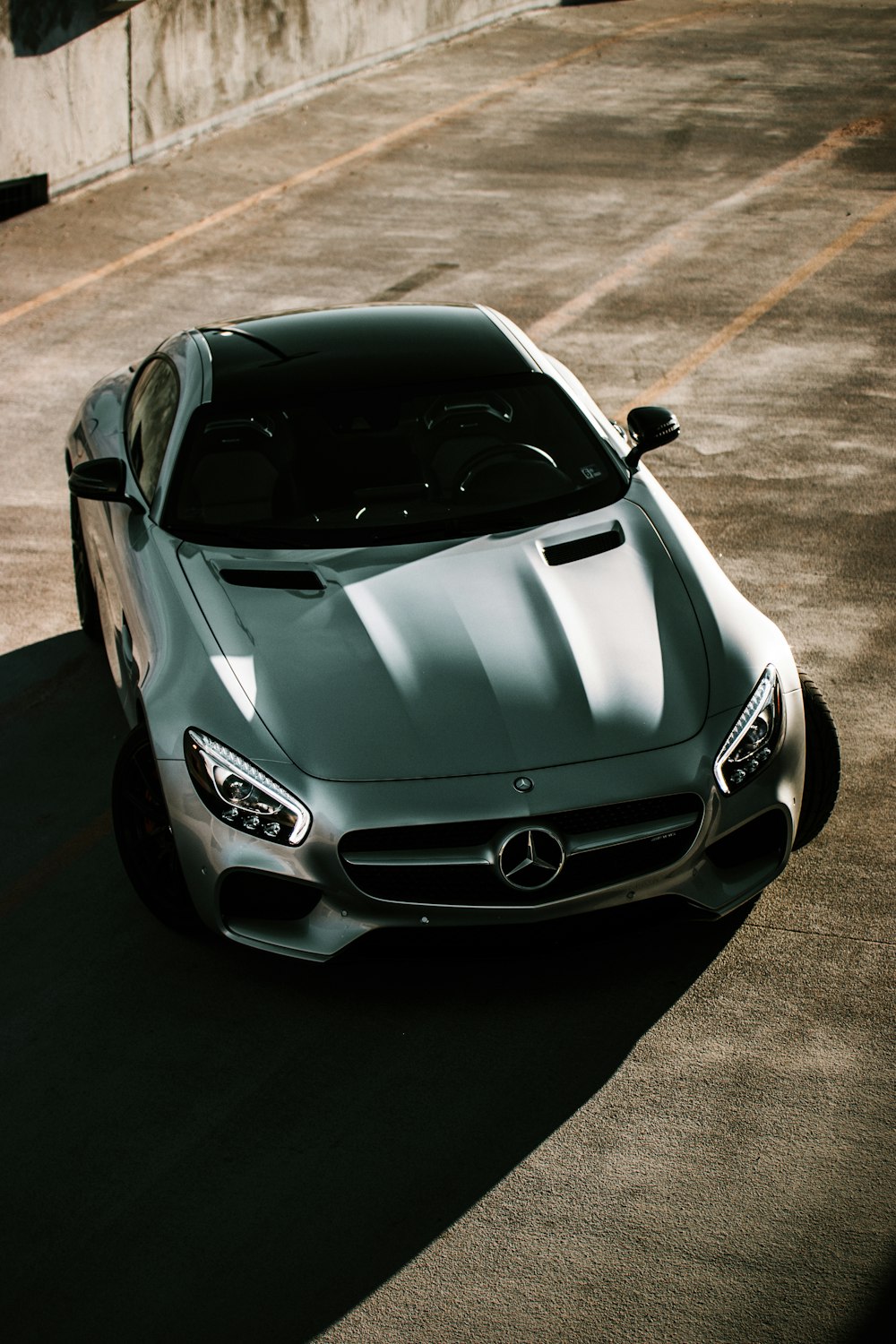 silver mercedes benz coupe on road during daytime