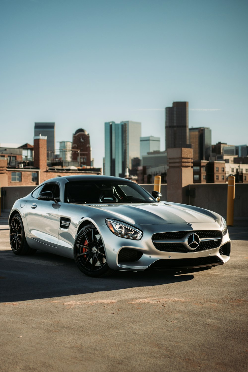 silver mercedes benz coupe on road during daytime