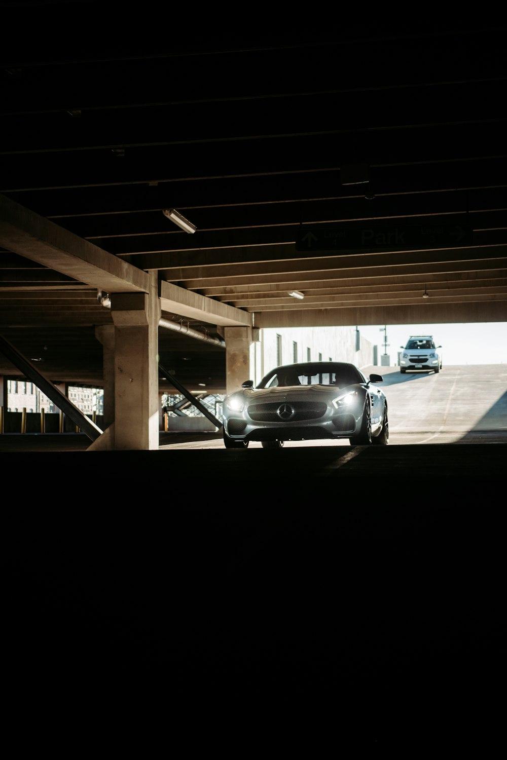 black sedan parked on parking lot