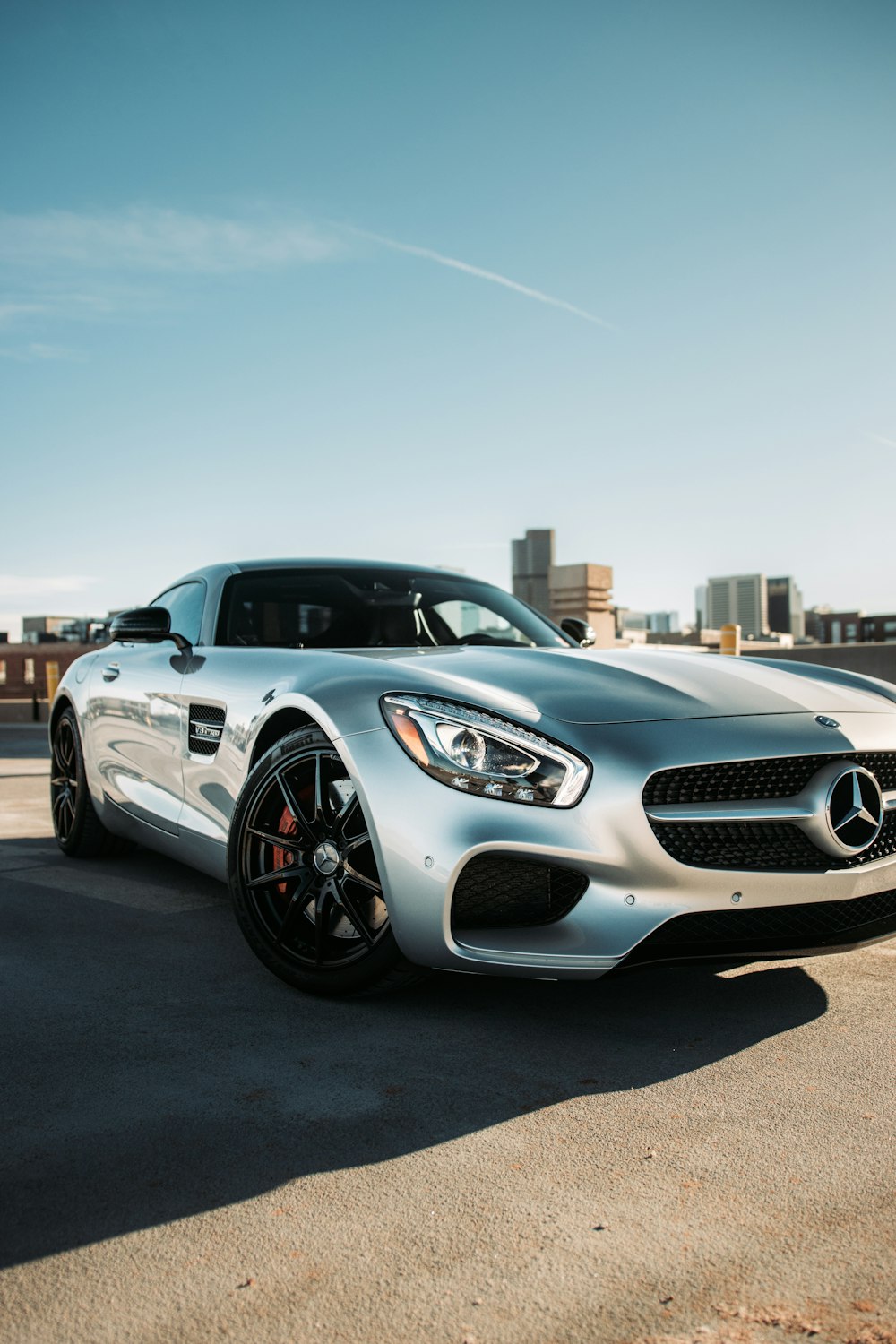 silver mercedes benz coupe on road during daytime