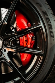 black and red car wheel