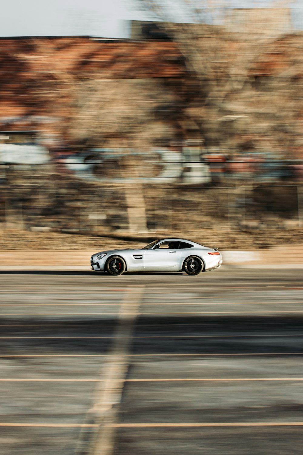 silver coupe on road during daytime