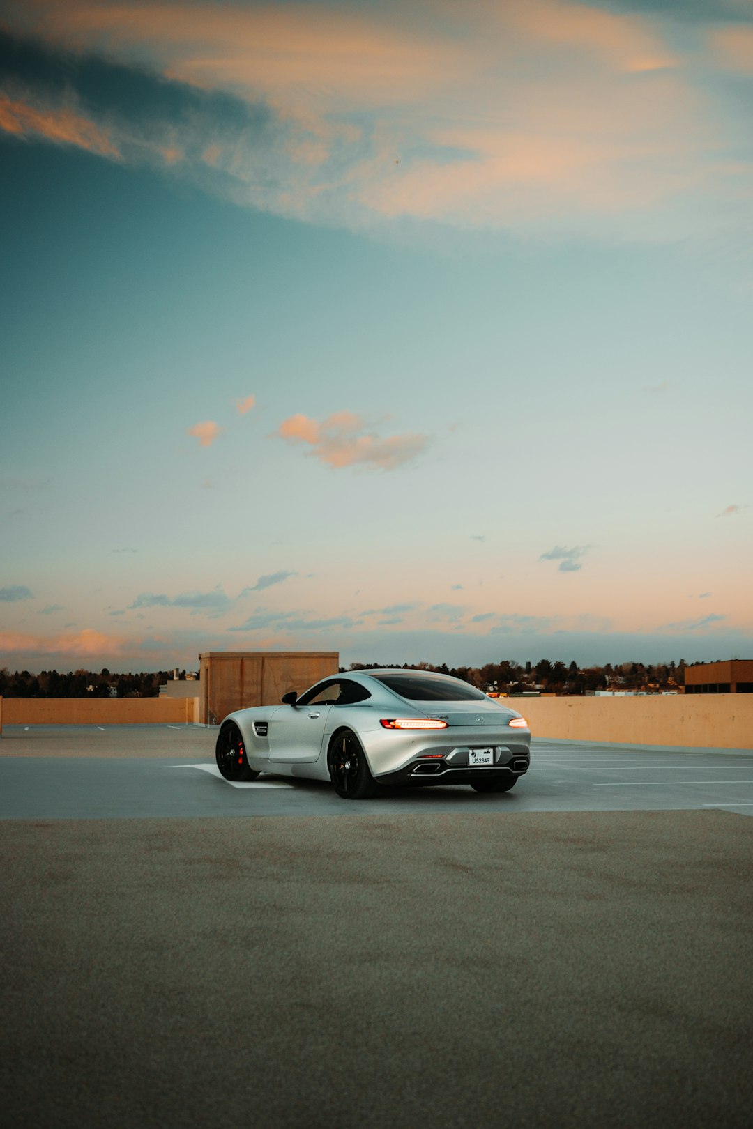 white porsche 911 on beach during sunset