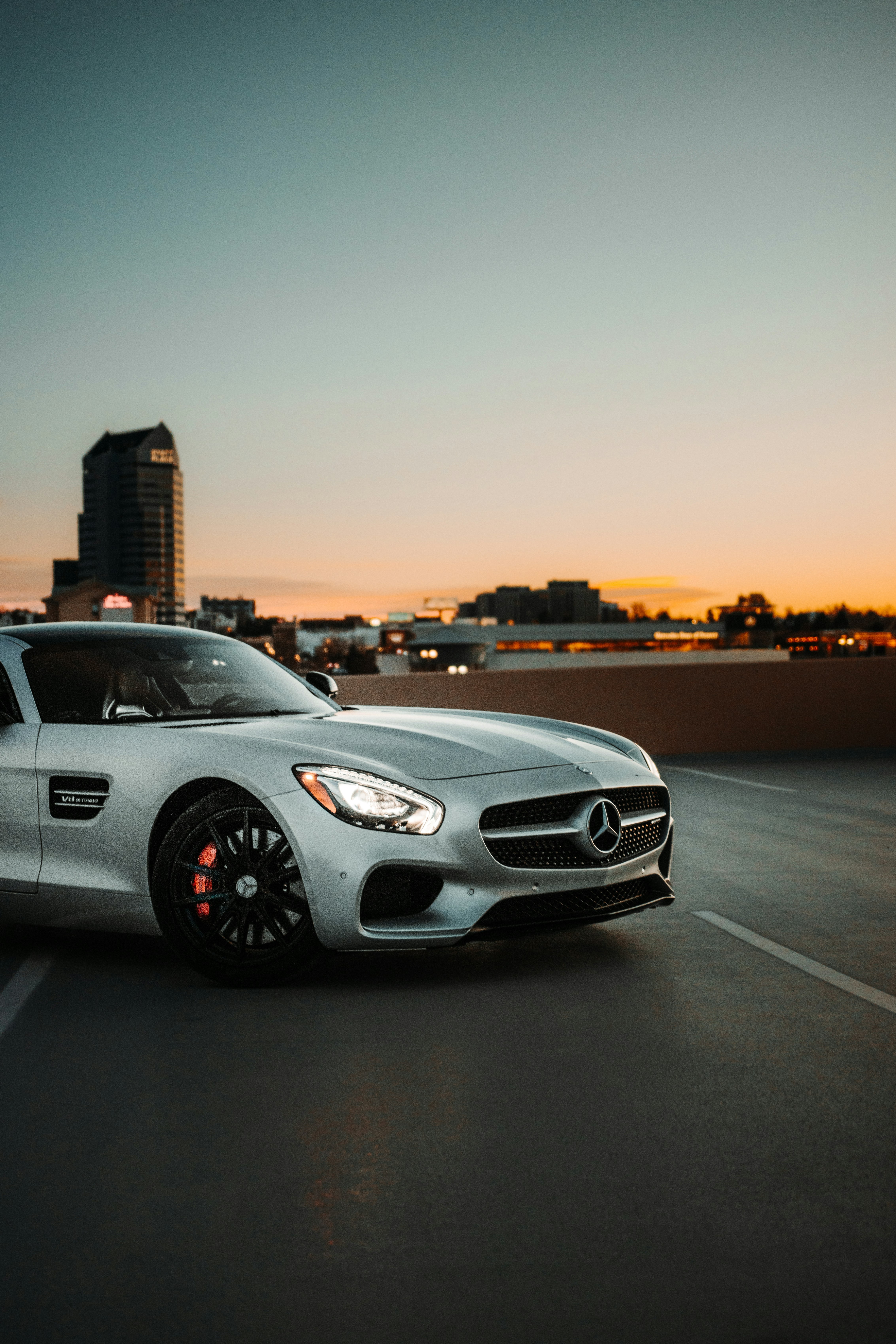 silver mercedes benz coupe on road during sunset