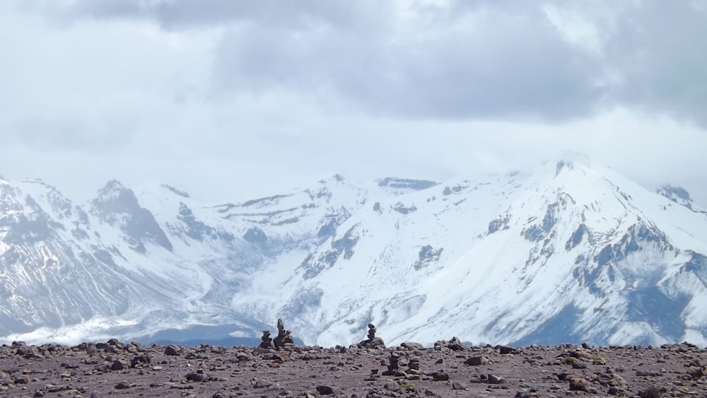 white and black mountains under white clouds during daytime