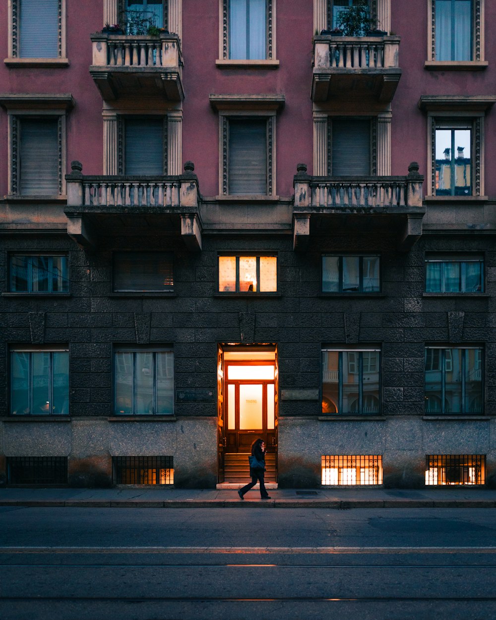 brown concrete building with light post