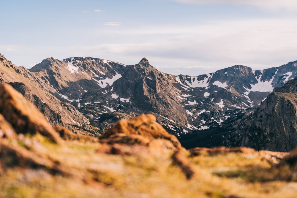 brown and black rocky mountain under white sky during daytime