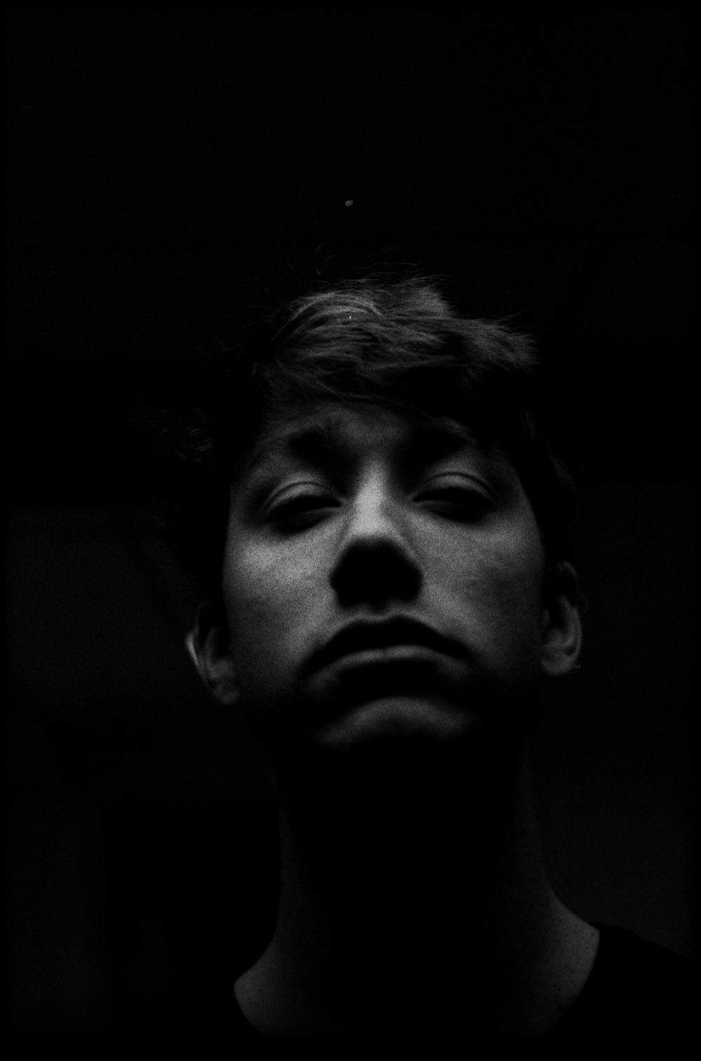 grayscale photo of mans face