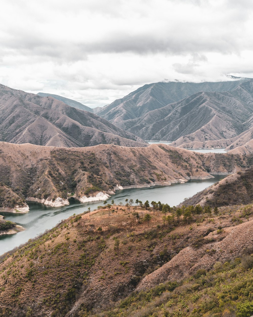 lake in the middle of mountains