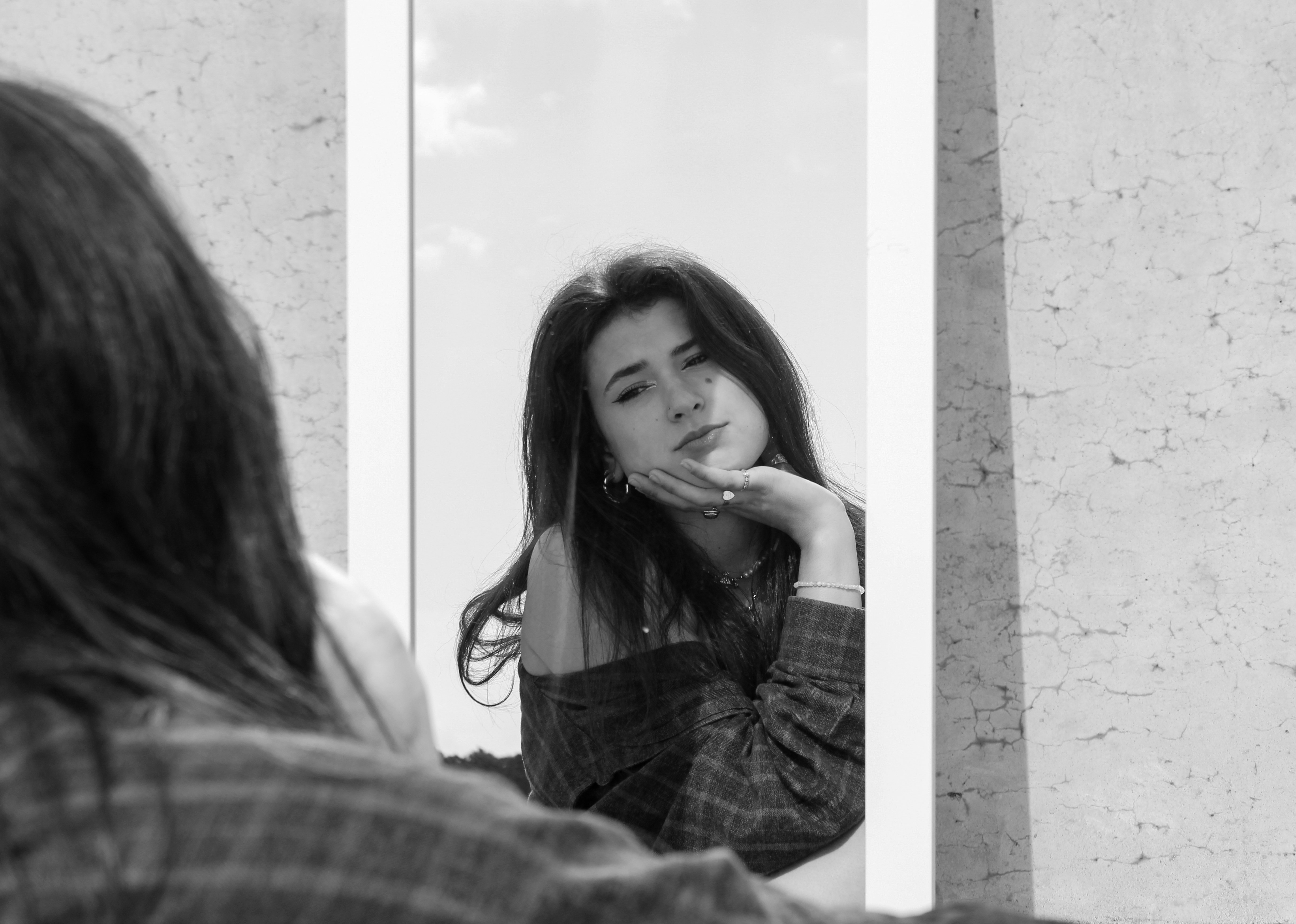 woman in black and white plaid dress shirt