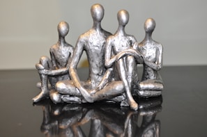 gray and black ceramic figurine