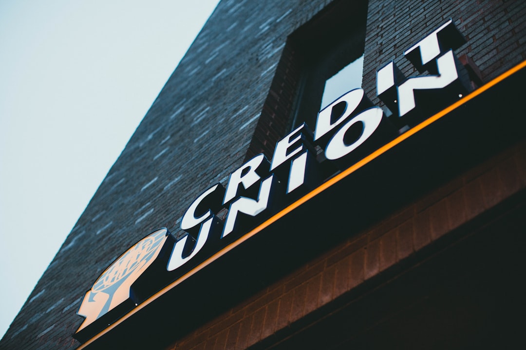 a sign on the side of a brick building,