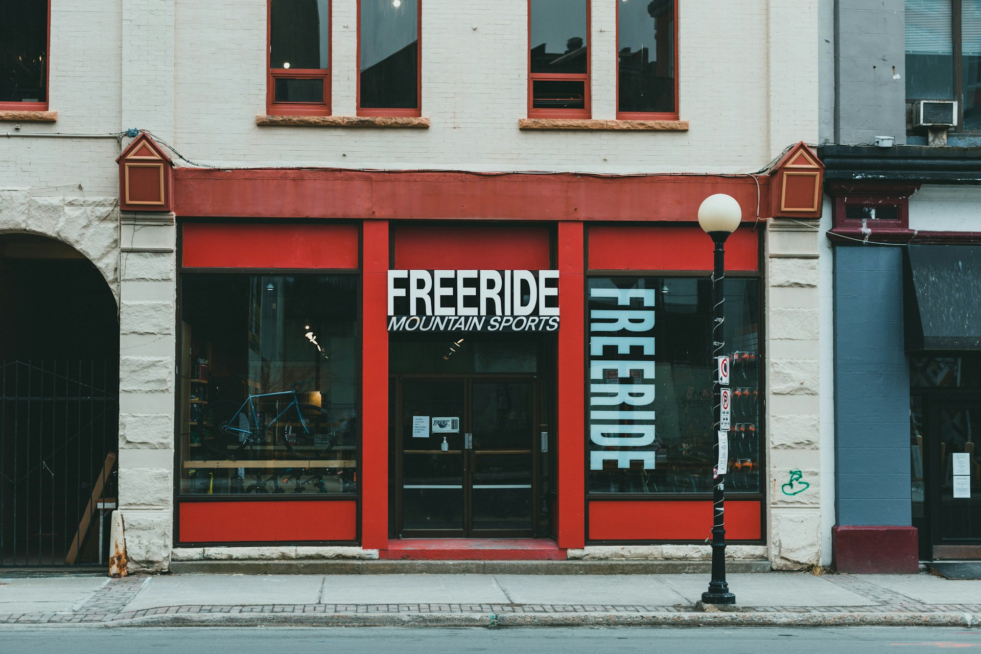 red and white store front during daytime