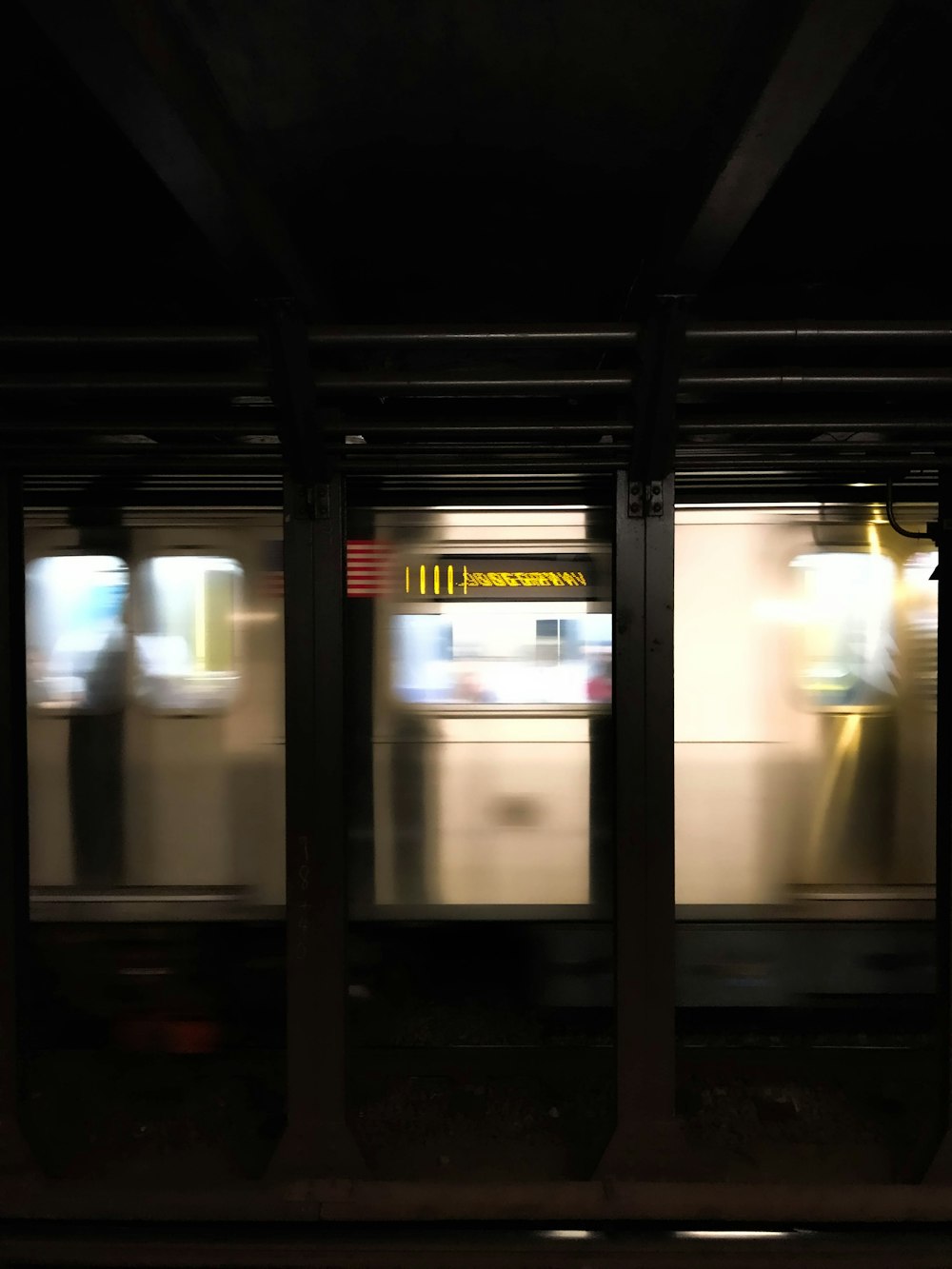 white and black train in train station