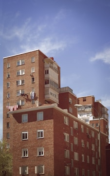 brown concrete building under blue sky during daytime
