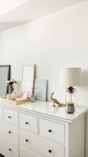 white and brown table lamp on white wooden table