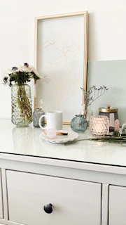 Simple yet stylish arrangement of calming home accessories on a clean white table