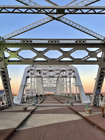 people walking on bridge during daytime