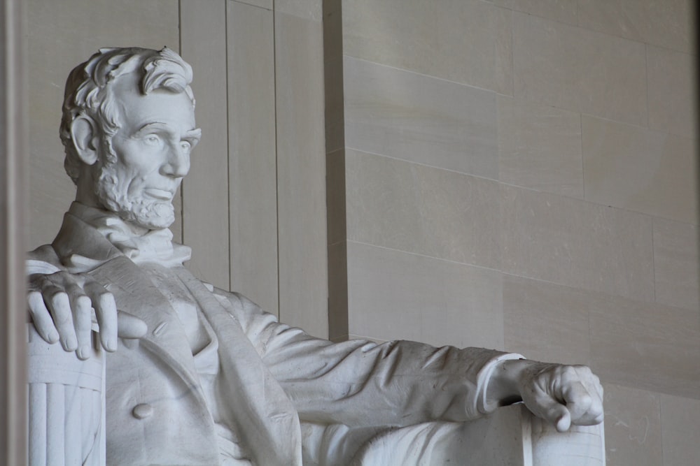 white concrete statue of man