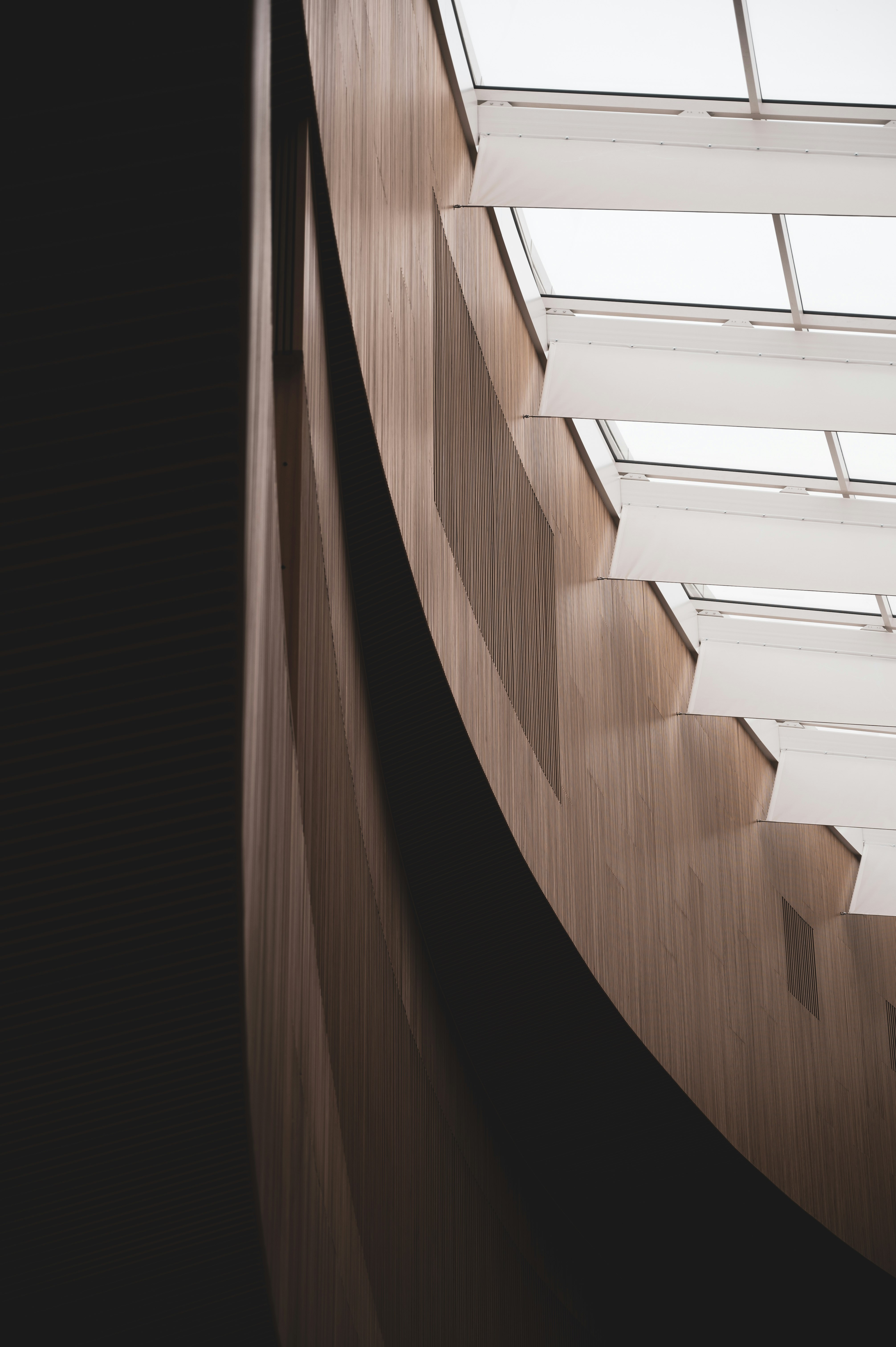 brown wooden staircase in grayscale photography