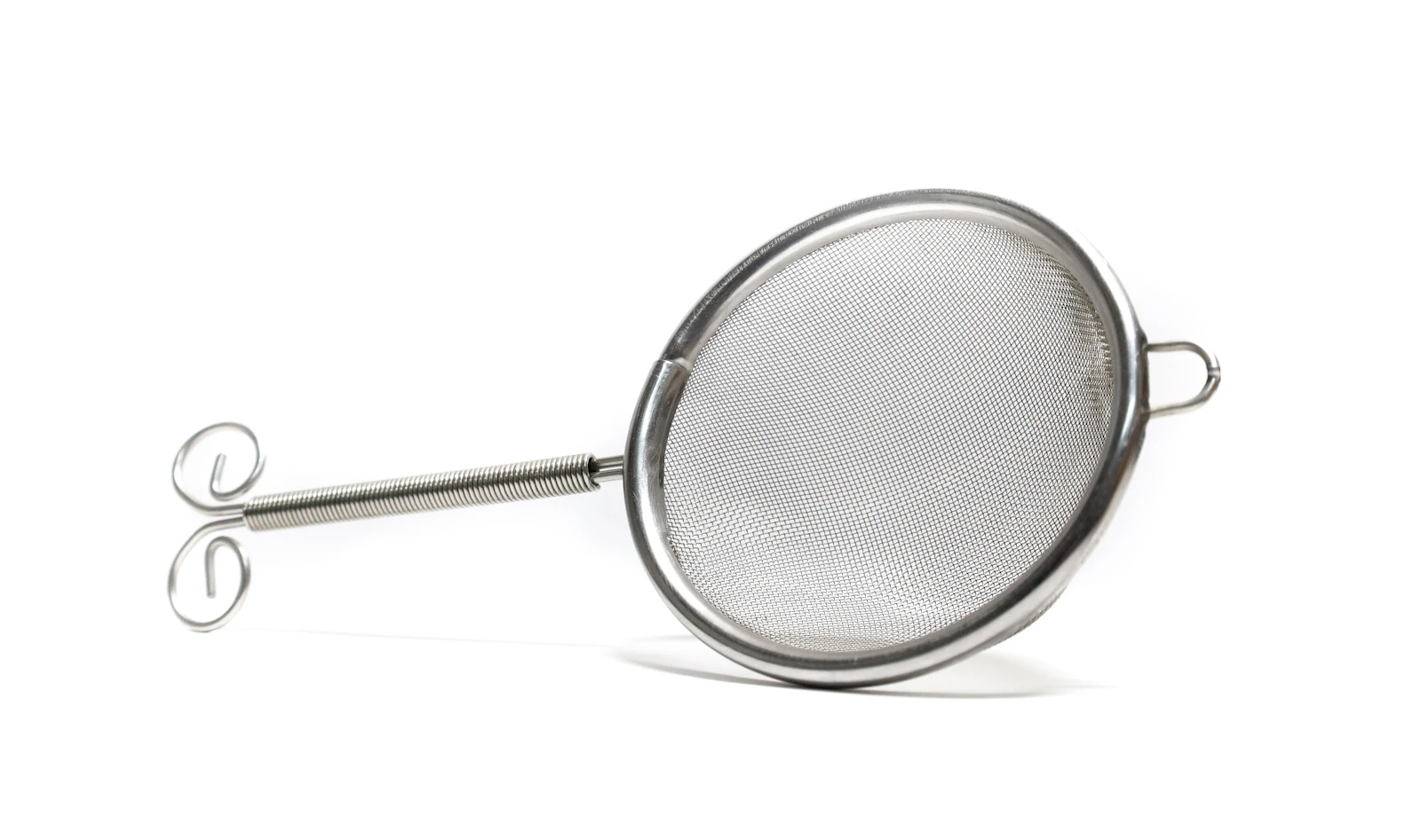 A stainless steel mesh strainer, representing a custom channel group's regex catching AI assistant traffic that the native channel's narrower matching lets through