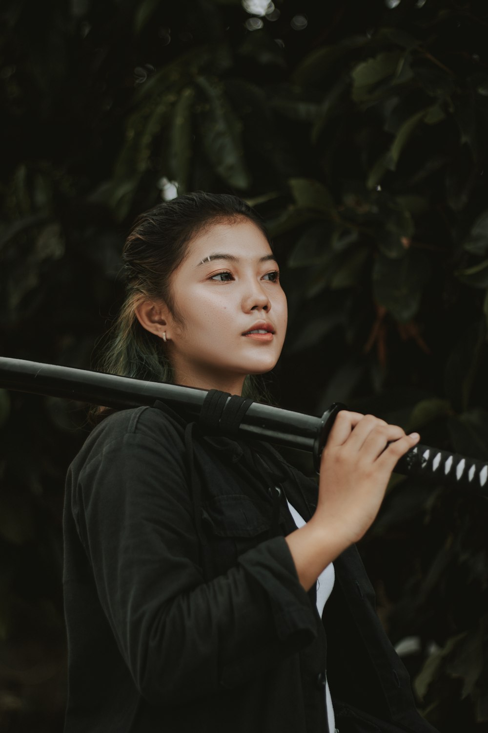 woman in black long sleeve shirt holding black and silver microphone